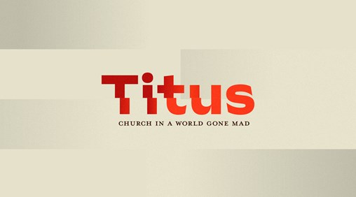 The word Titus written in red on a gold background