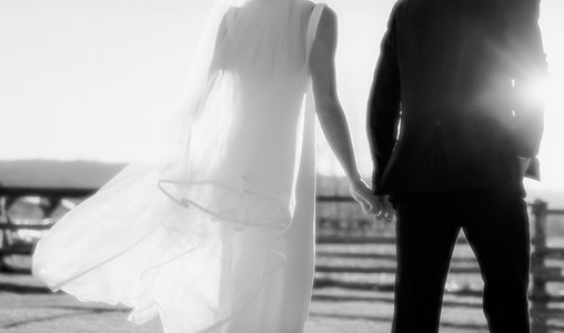 Gentle wife and husband on wedding day picturing marriage